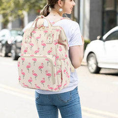 Xunteny corduroy diaper bag side pocket keeps tissues or bottles within reach.