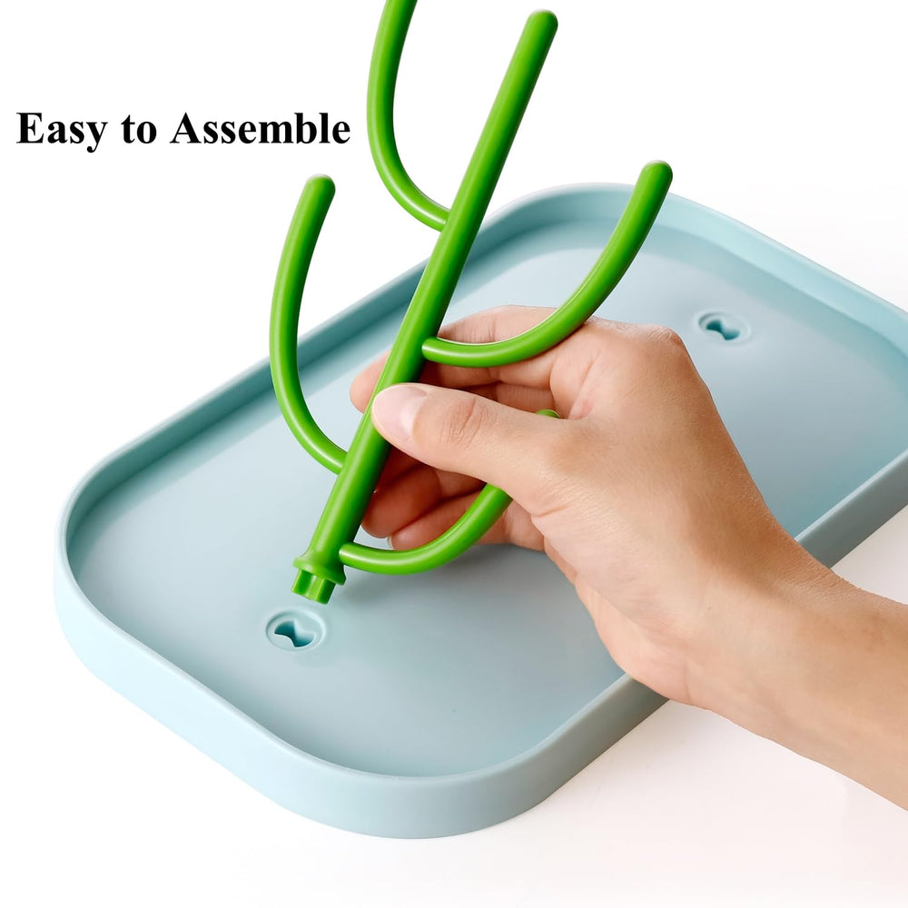 XYW drying rack holding bottles and nipples emphasizes organized drying after feeds.