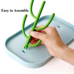 XYW drying rack holding bottles and nipples emphasizes organized drying after feeds.