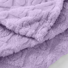 Yagle Mate crib blanket fold demonstrating portability for travel and naps