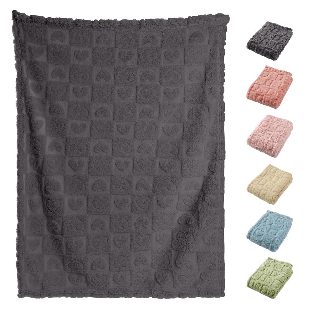 Yagle Mate heart checkered pattern blanket adds cozy charm to nursery decor.