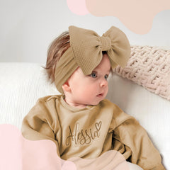 YanJie white bow headbands add classic charm to baby outfits
