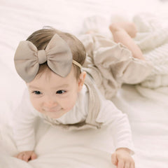 YanJie baby headband worn as newborn photo prop.