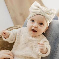 YanJie beige double-bows headband complements outfits for everyday occasions.