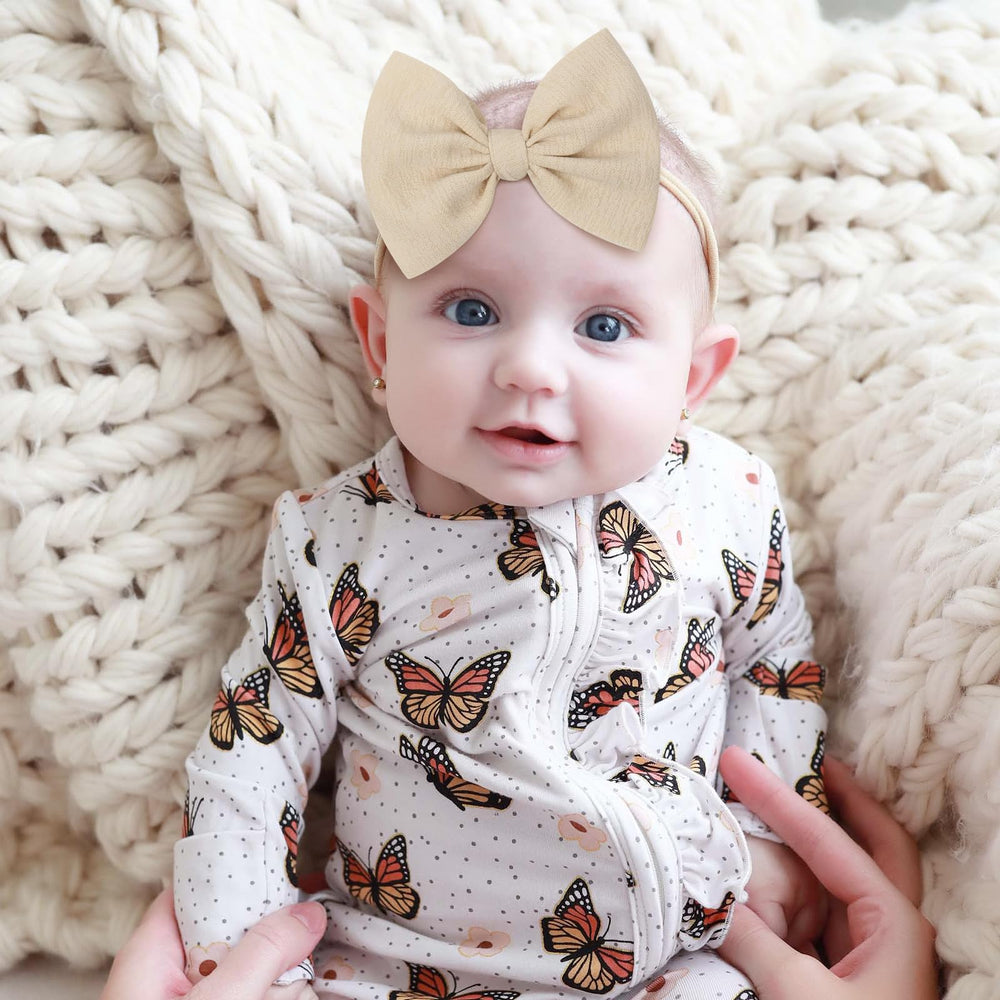 YanJie knotted bows white headband to keep baby stylish all day.
