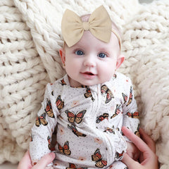 YanJie knotted bows white headband to keep baby stylish all day.