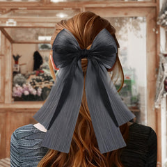 YanJie chiffon bow closeup with metal clip highlights textured layers and durable support.