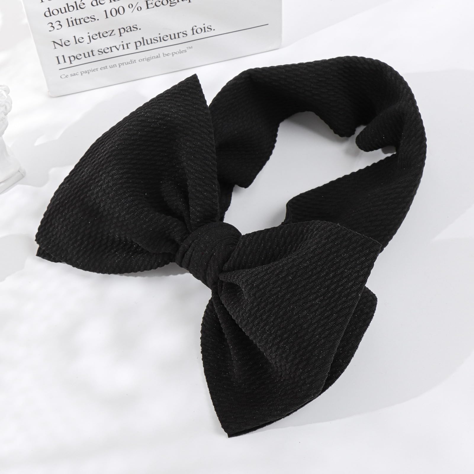 YanJie Hairband worn on baby during a photoshoot.