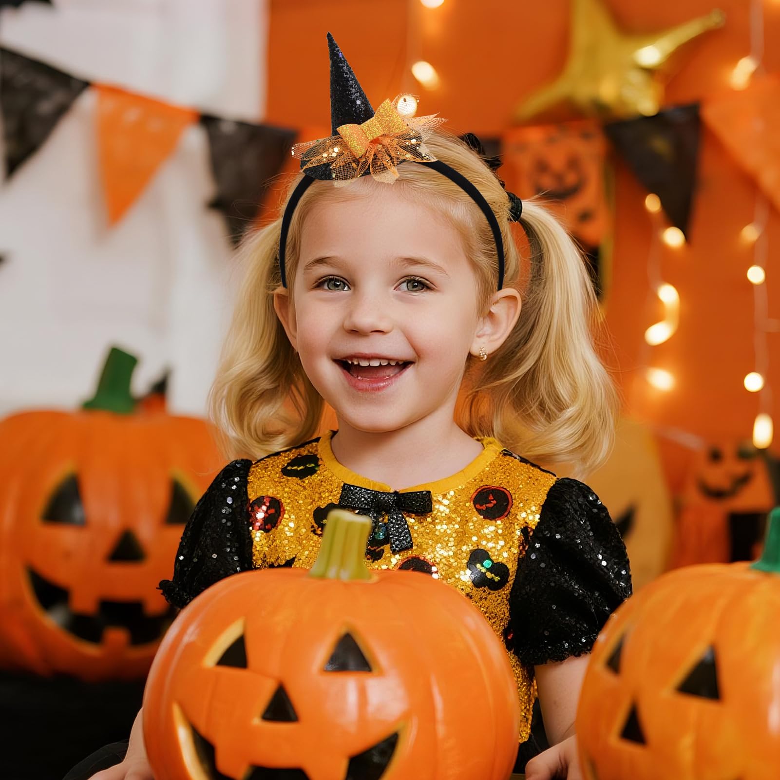 YanJie orange-bow headband detail highlights playful Halloween styling for babies.