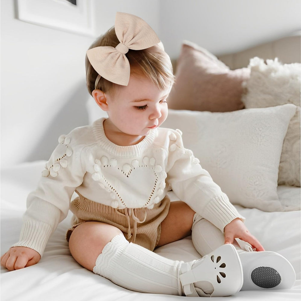 YanJie handmade bows on soft nylon bands for comfortable wear.