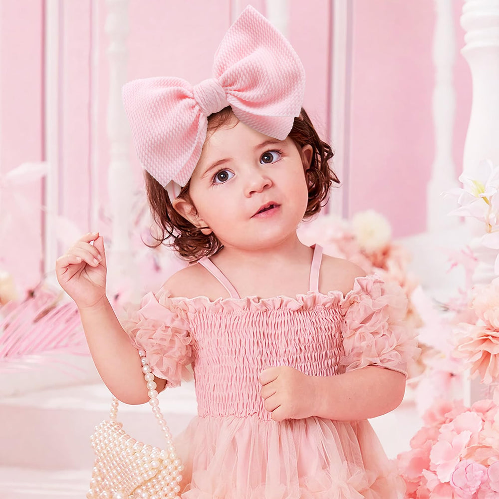 YanJie pink bow headband close-up showing soft nylon band and gentle fit