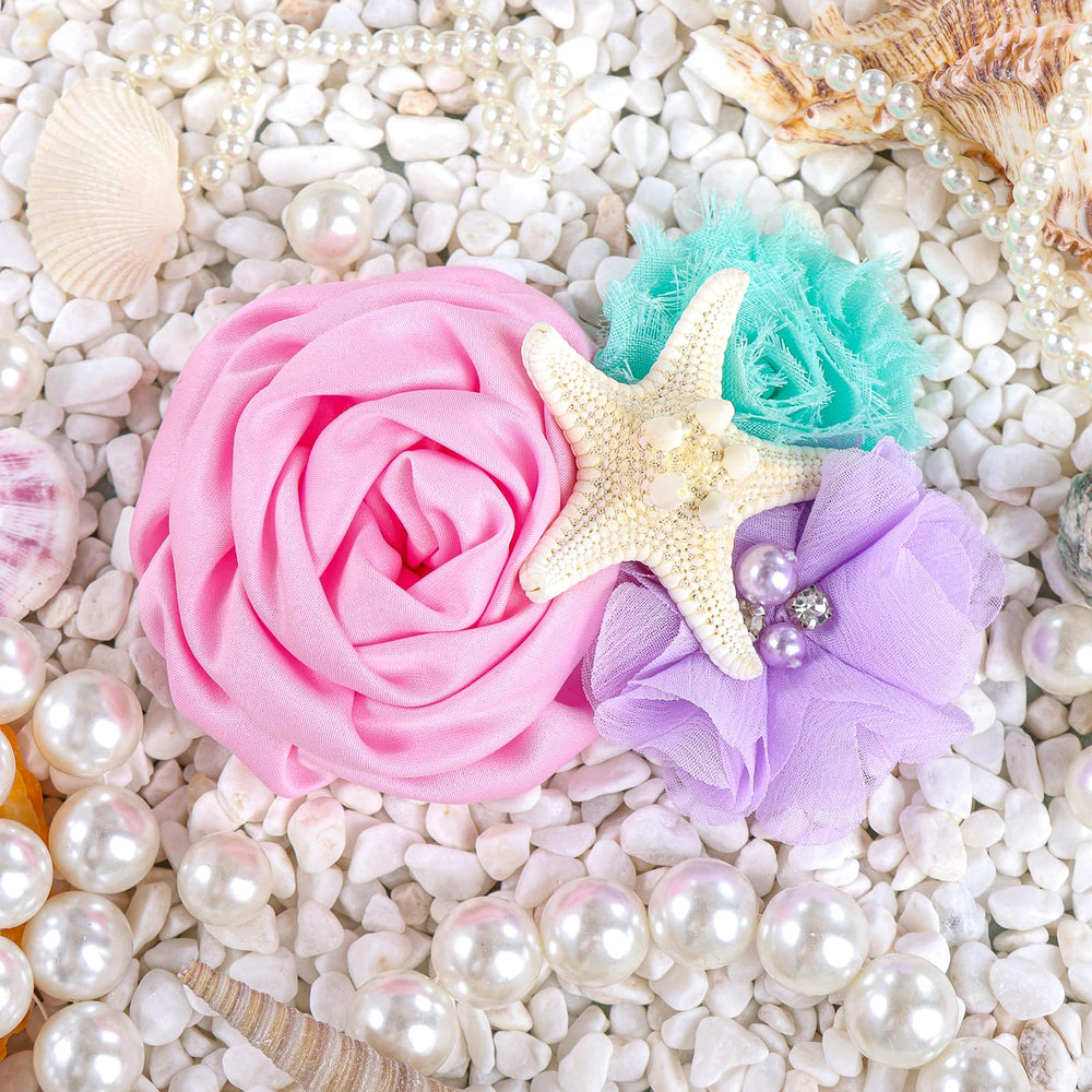 YanJie mermaid-themed party look hair clip on a baby girl.