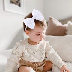 Yanjie newborn velvet bow pink closeup showcasing comfy headband fit.