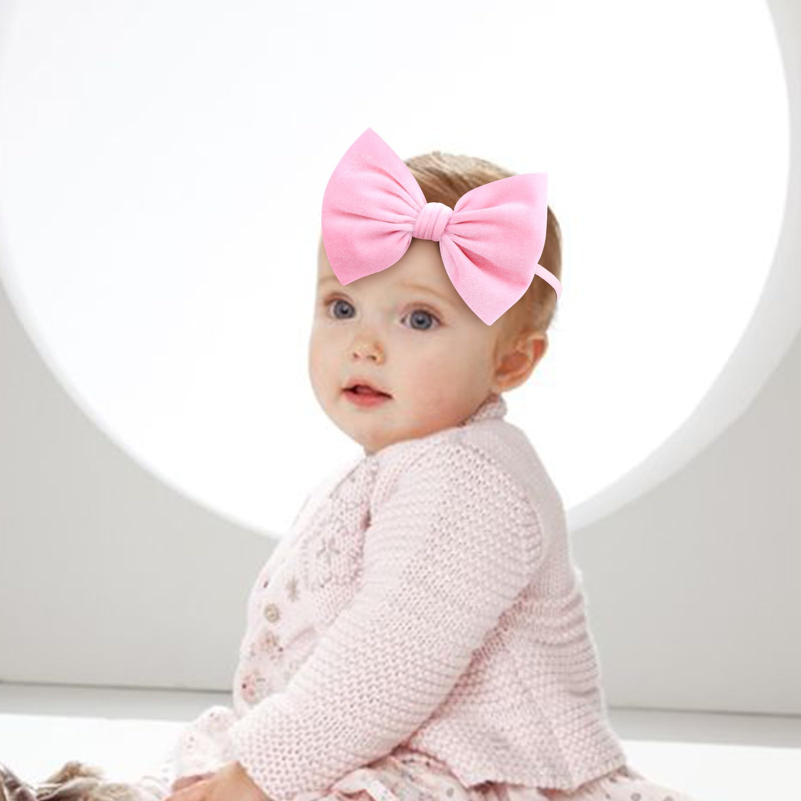 Yanjie newborn velvet bow white closeup highlighting soft material for gentle wear.