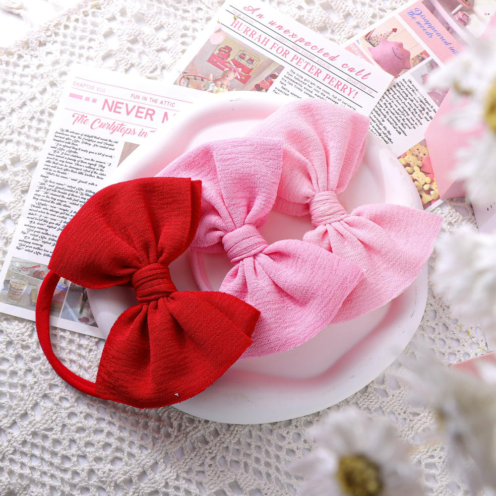 YanJie pink and red baby bows 3-pack for quick outfit changes.