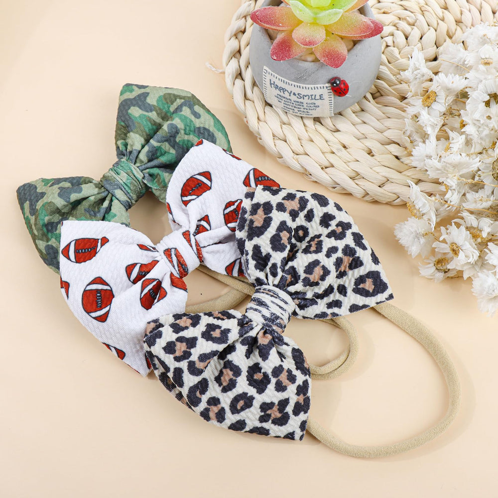 YanJie sporty-camo headband demonstrates versatile daily looks for baby girls