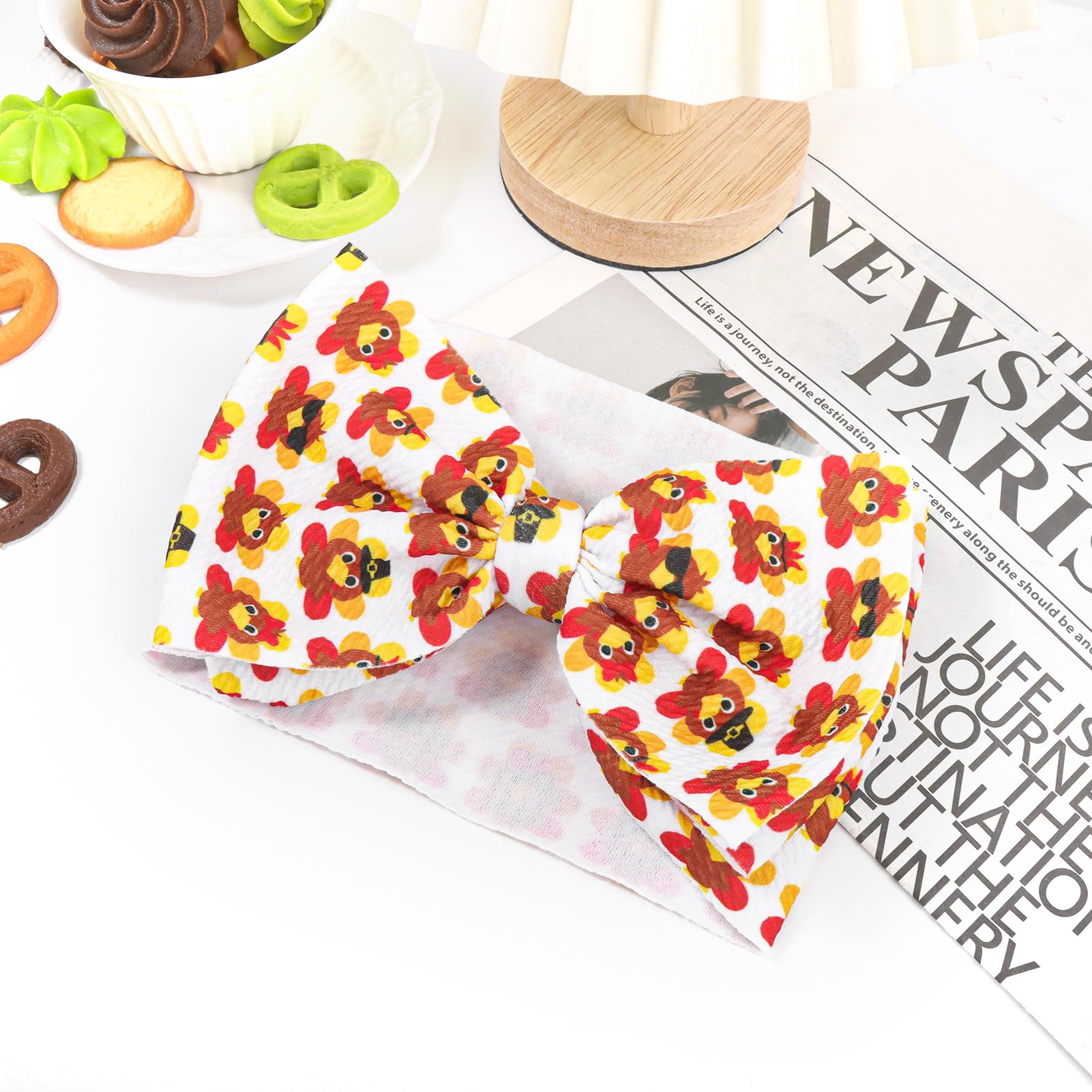 Yanjie turkey-printed bow detail highlights bold seasonal styling.