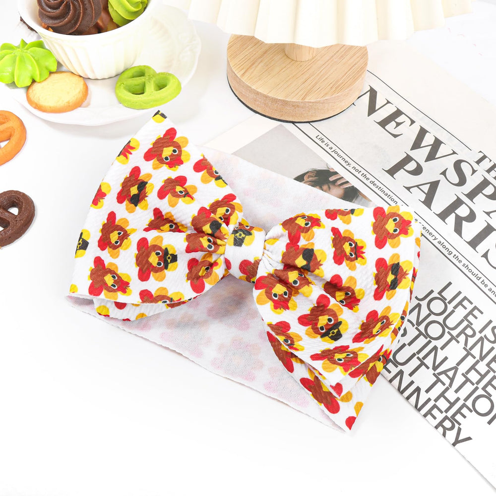 Yanjie turkey-printed bow detail highlights bold seasonal styling.