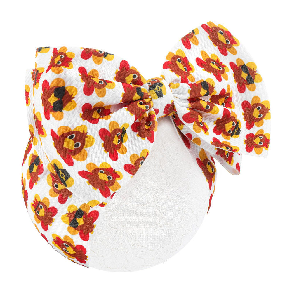 Yanjie turkey-printed headband enhances festive Thanksgiving look.
