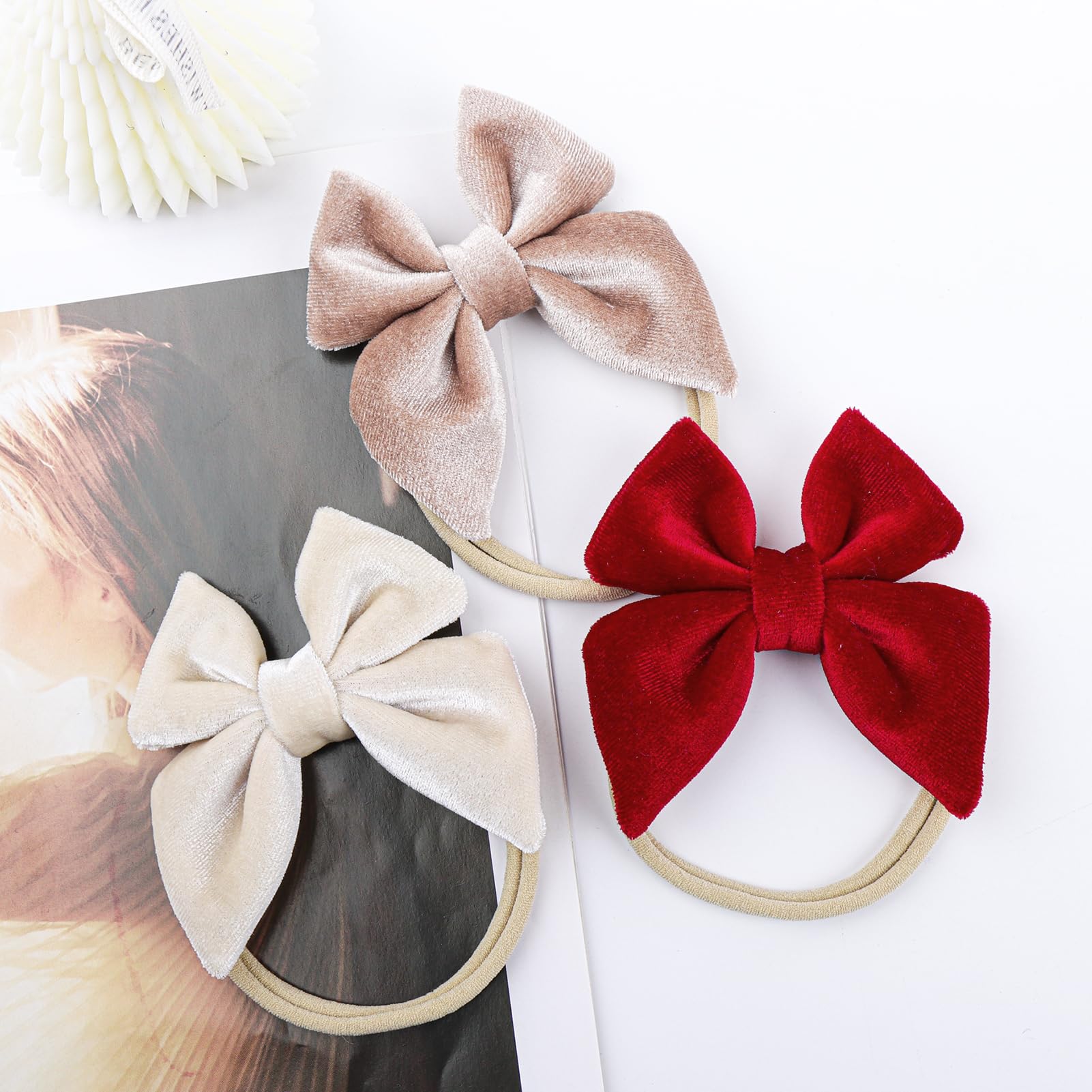 YanJie velvet bow headband in grey on child with cozy texture