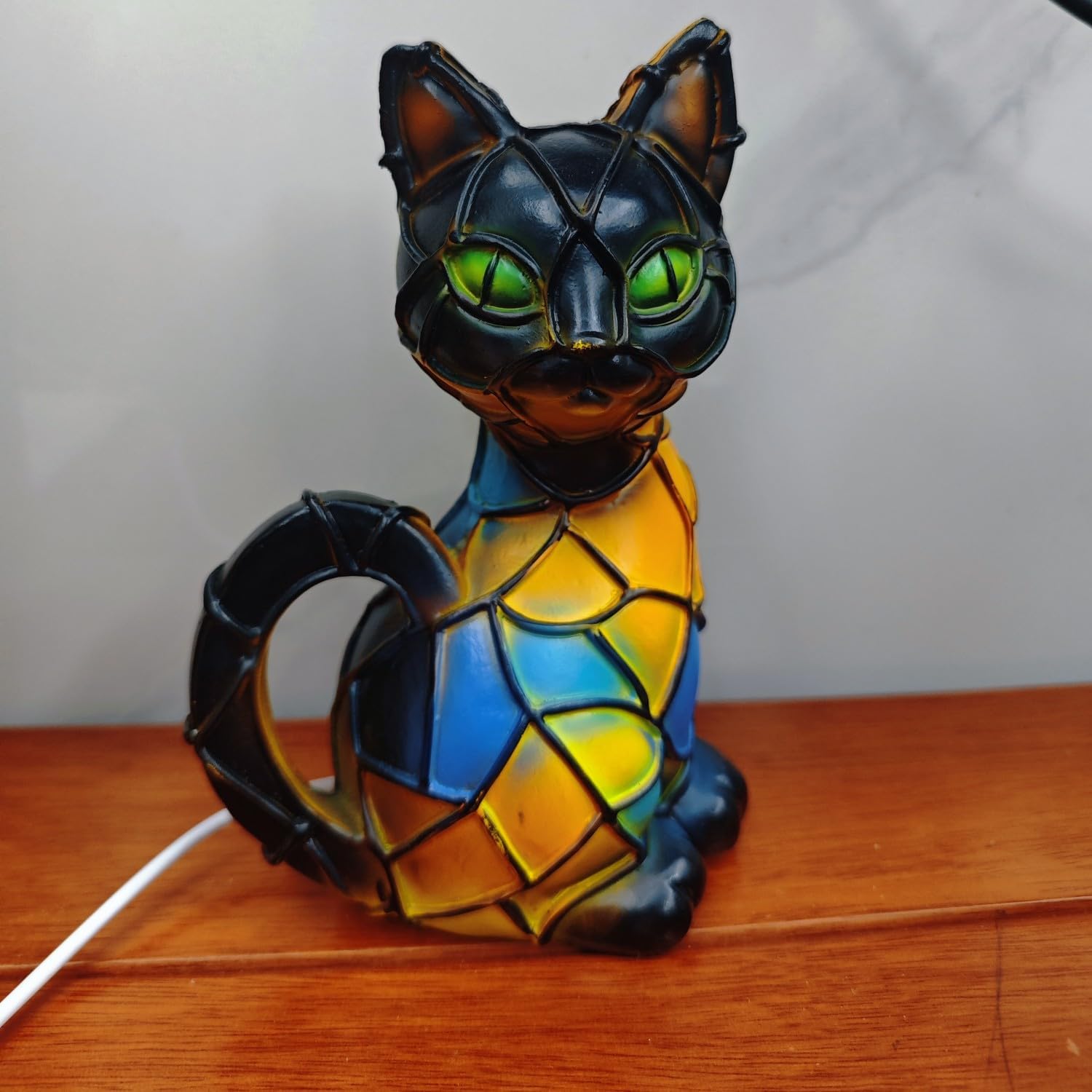 Yckeogln Retro Cat Lamp colorfully shines resin accents to elevate living room decor.