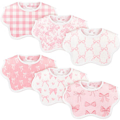 Yearntown baby muslin bibs with pink bow flatlay showing coordinated style and drool protection