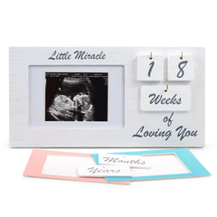 YelloIris white ultrasound-frame milestone-tiles showcases pregnancy memories with adjustable display for keepsakes.