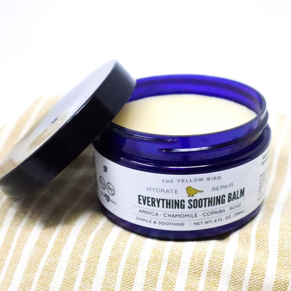 Daily-use scene with The Yellow Bird balm for hands, feet, and skin.
