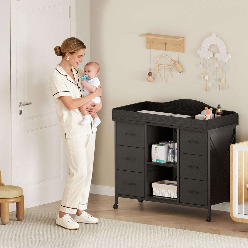 Yetom 6-drawer dresser in black offers ample storage for diapers and outfits.