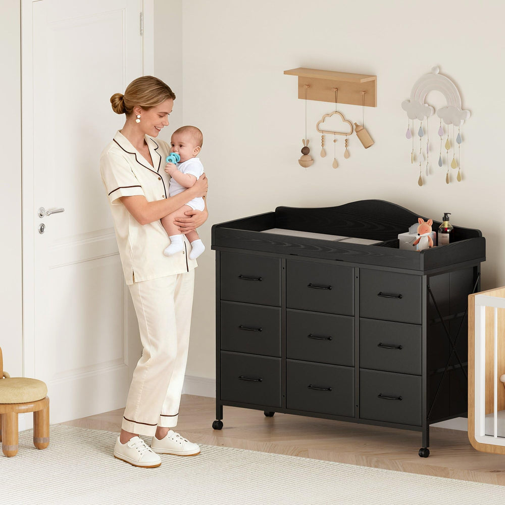 YeTom nine-drawer storage space keeps diapers, toys, and care items organized