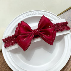 Yheahin satin-crystal bow close-up shows delicate sparkle for party-ready looks.