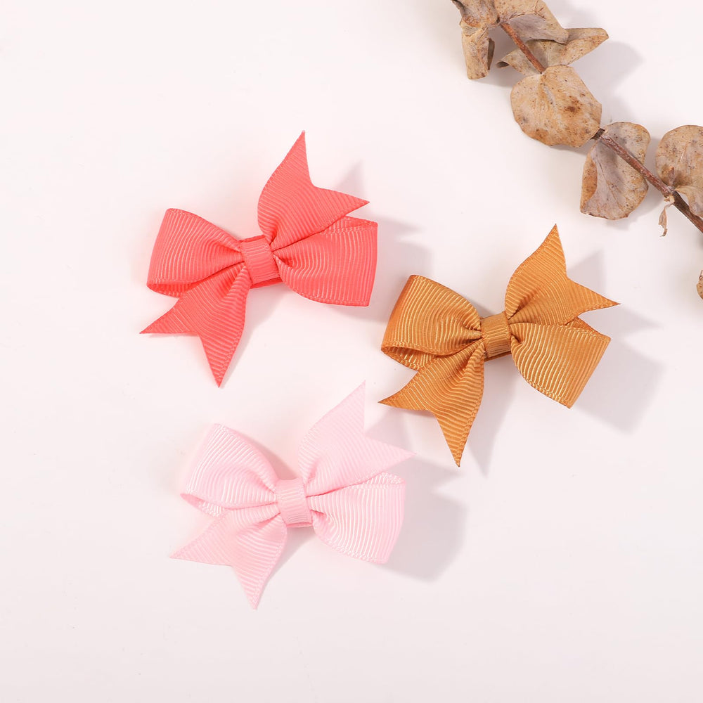 YHXX YLEN 2-inch bow clips secure in fine or thick hair.