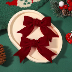 Yhlen velvet bow in pigtails set for coordinated looks.