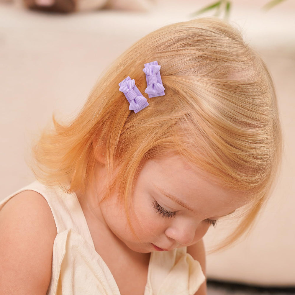 YHXX YLEN tiny bow clips close-up, lightweight design comfortable for delicate hair.
