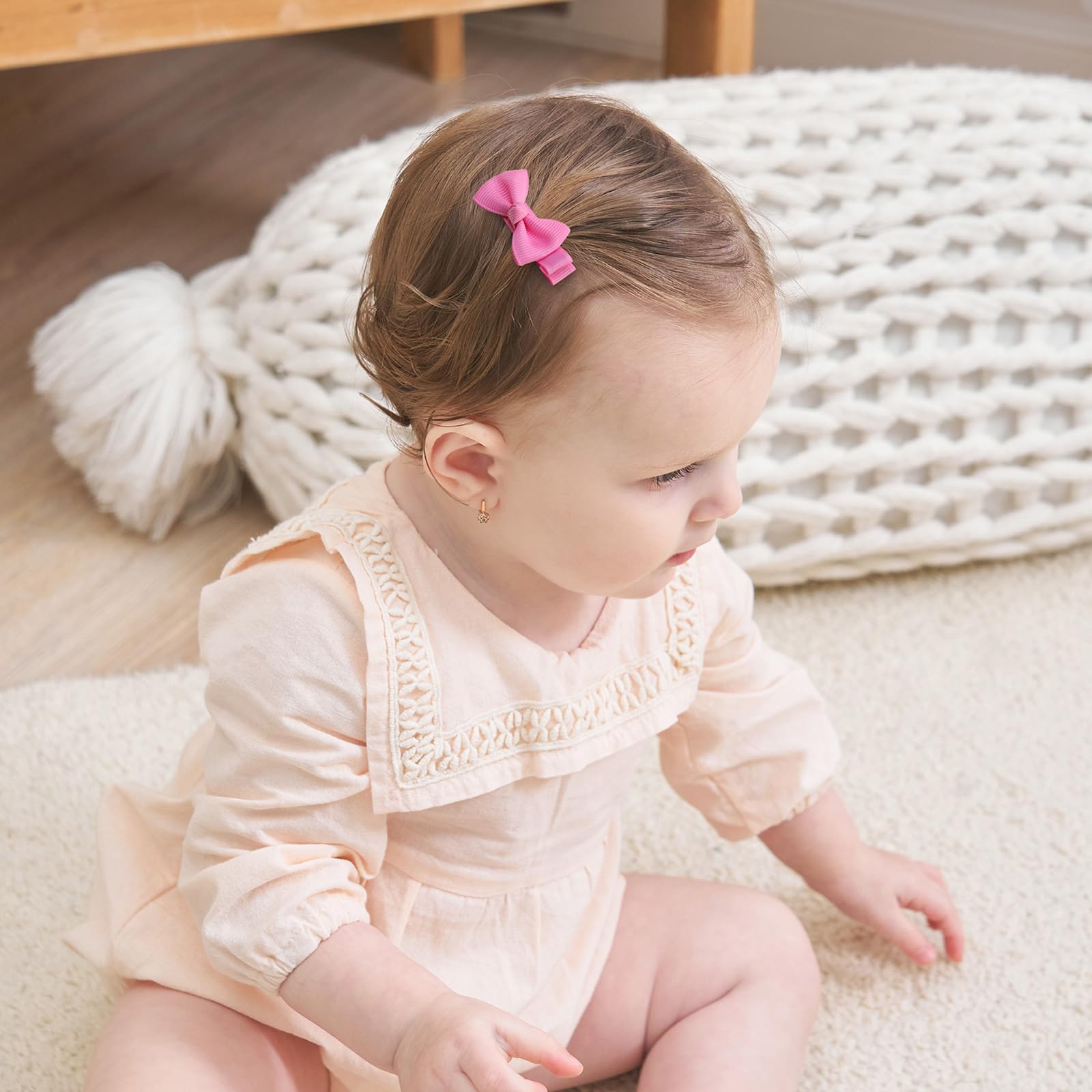 Bows on a baby’s head in side view by YHXX YLEN.