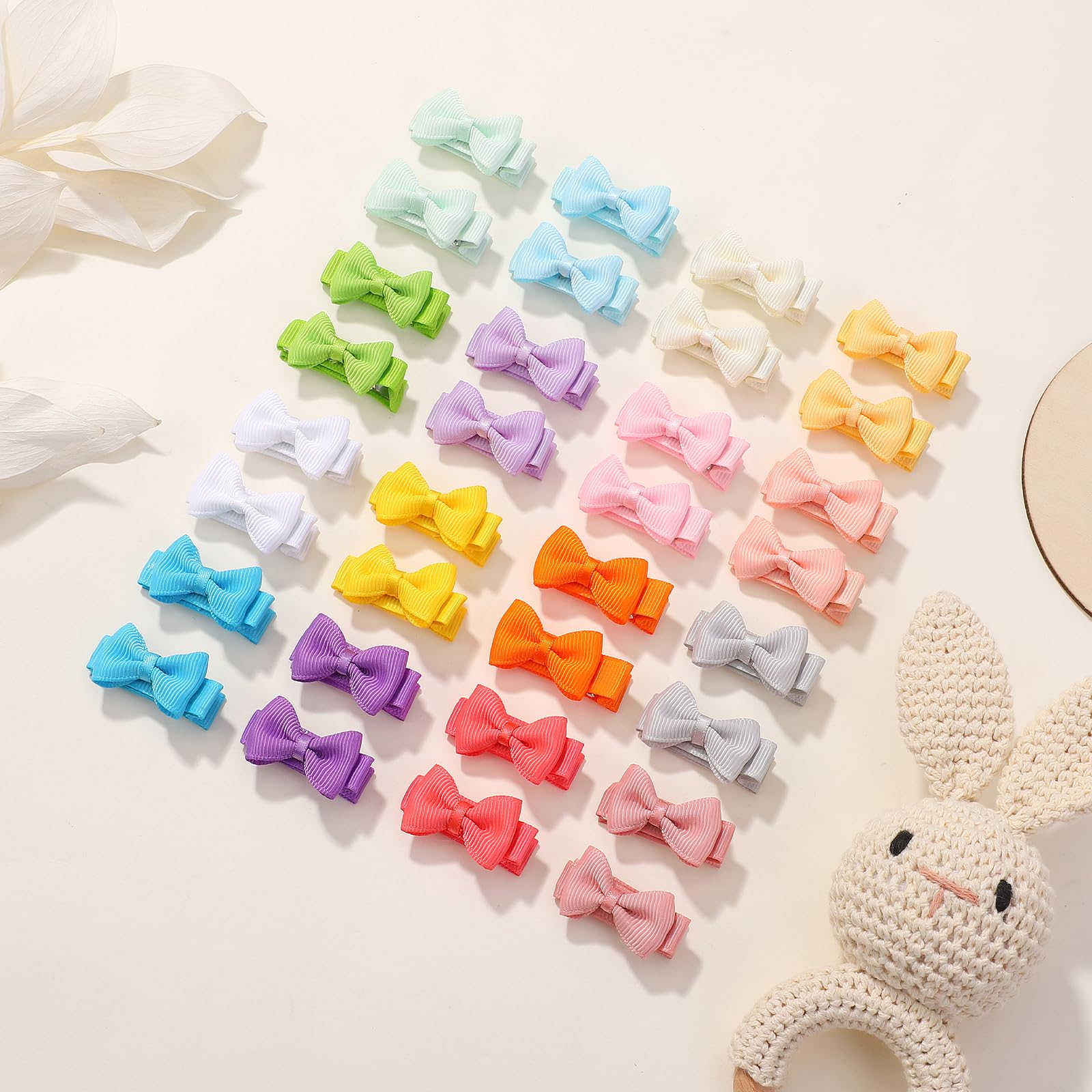 YHXX YLEN secure clip mechanism on tiny bows for reliable wear