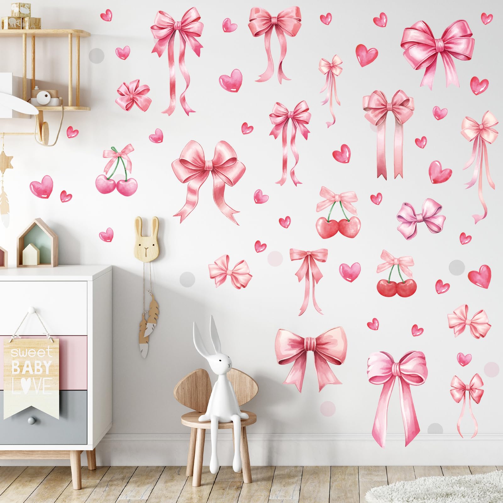 Yinder Coquette pink bow decal collection on bedroom wall for a soft, inviting vibe.
