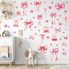 Yinder Coquette pink bow decal collection on bedroom wall for a soft, inviting vibe.