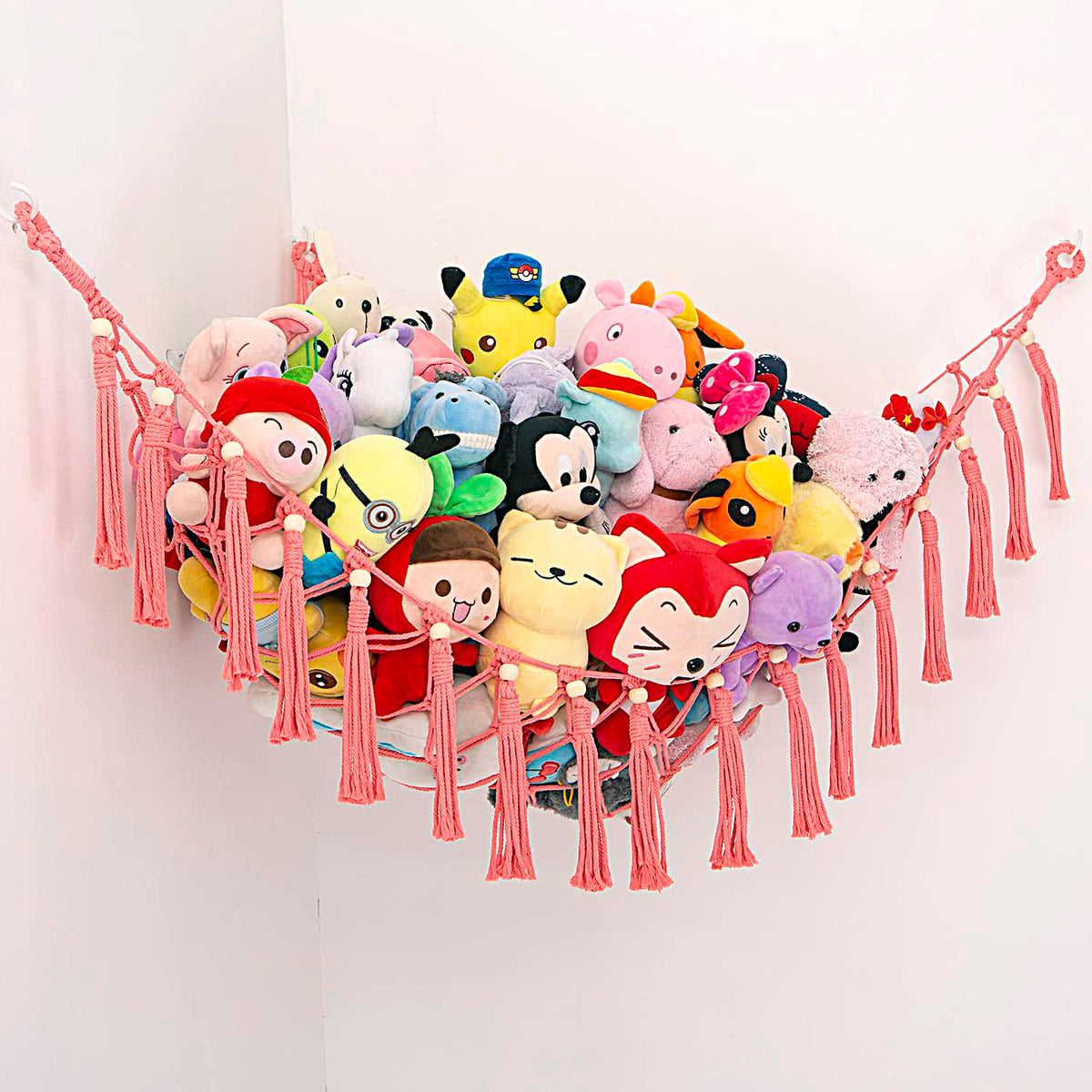 YKBU MAKEONEWO pink macrame hammock corner display for space-saving toy storage.