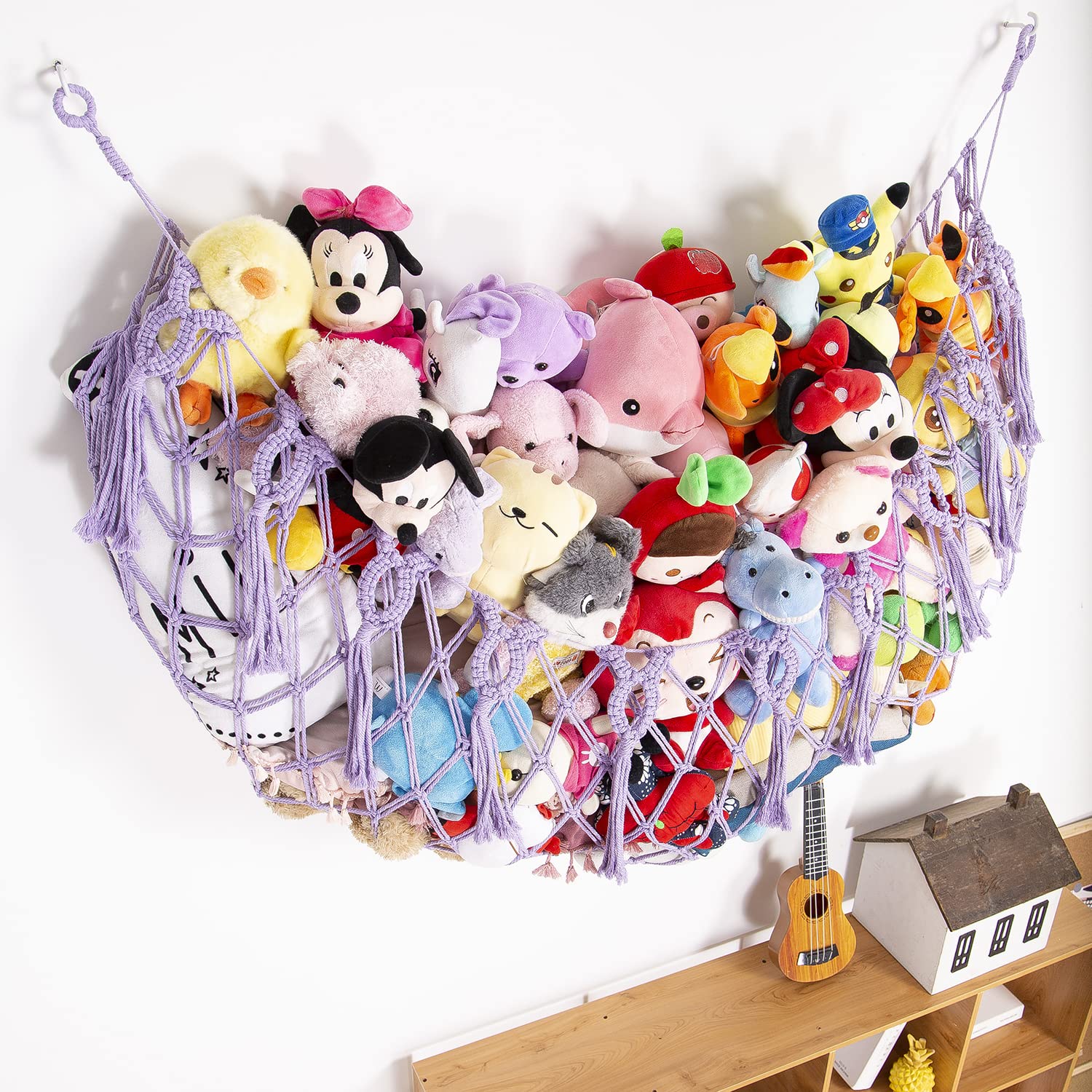 YKBU nursery wall display for stuffed animals creates organized space.