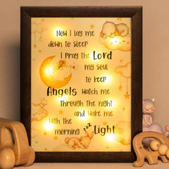 YLOVAN baptism night-light frame in brown provides a gentle glow for bedtime.
