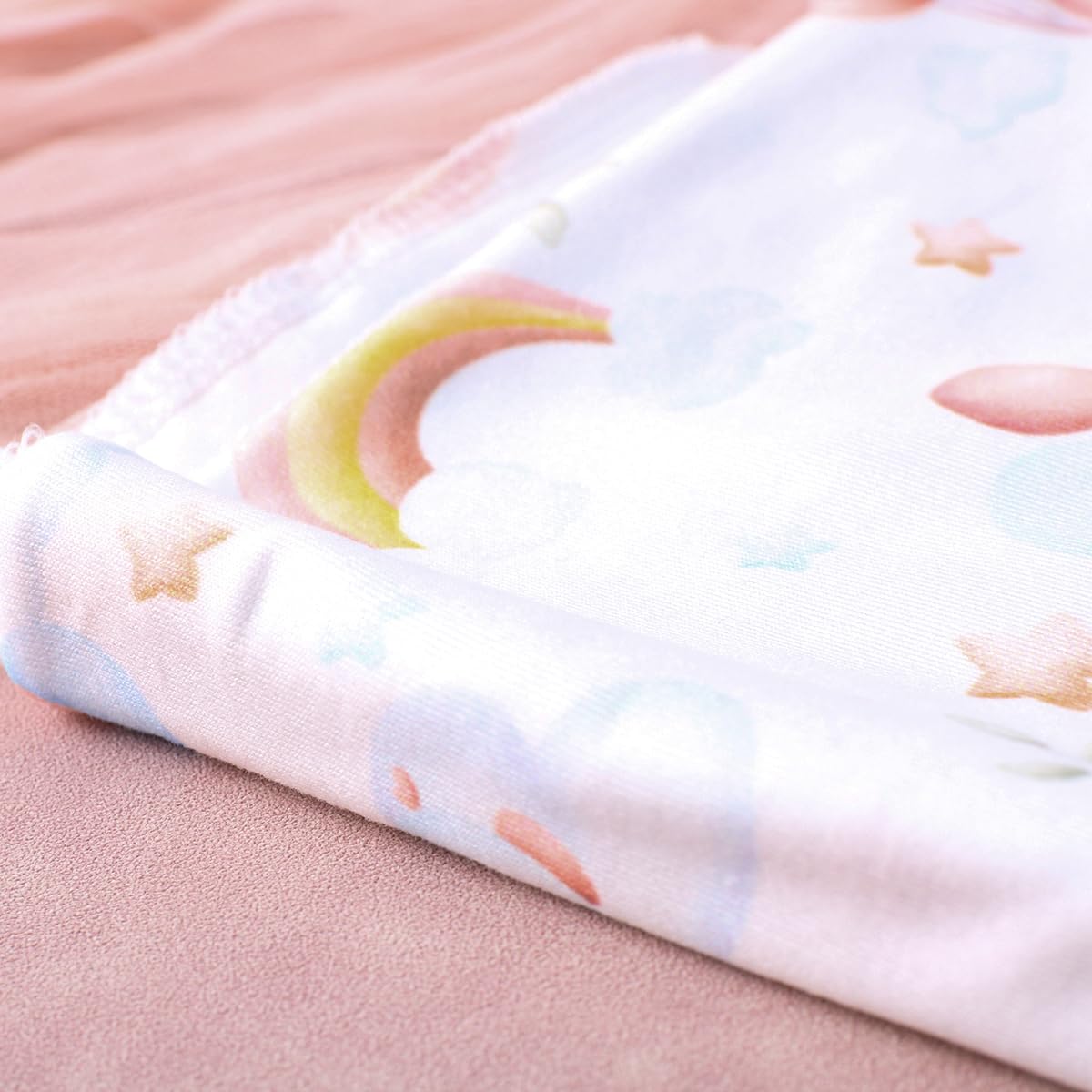 Ylsteed swaddle blanket used as stroller canopy for on-the-go shade.