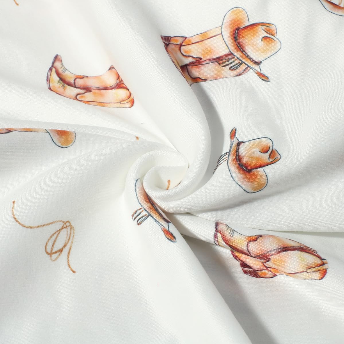 Ylsteed newborn sleep scene with calm baby wrapped in cowboy-themed blanket