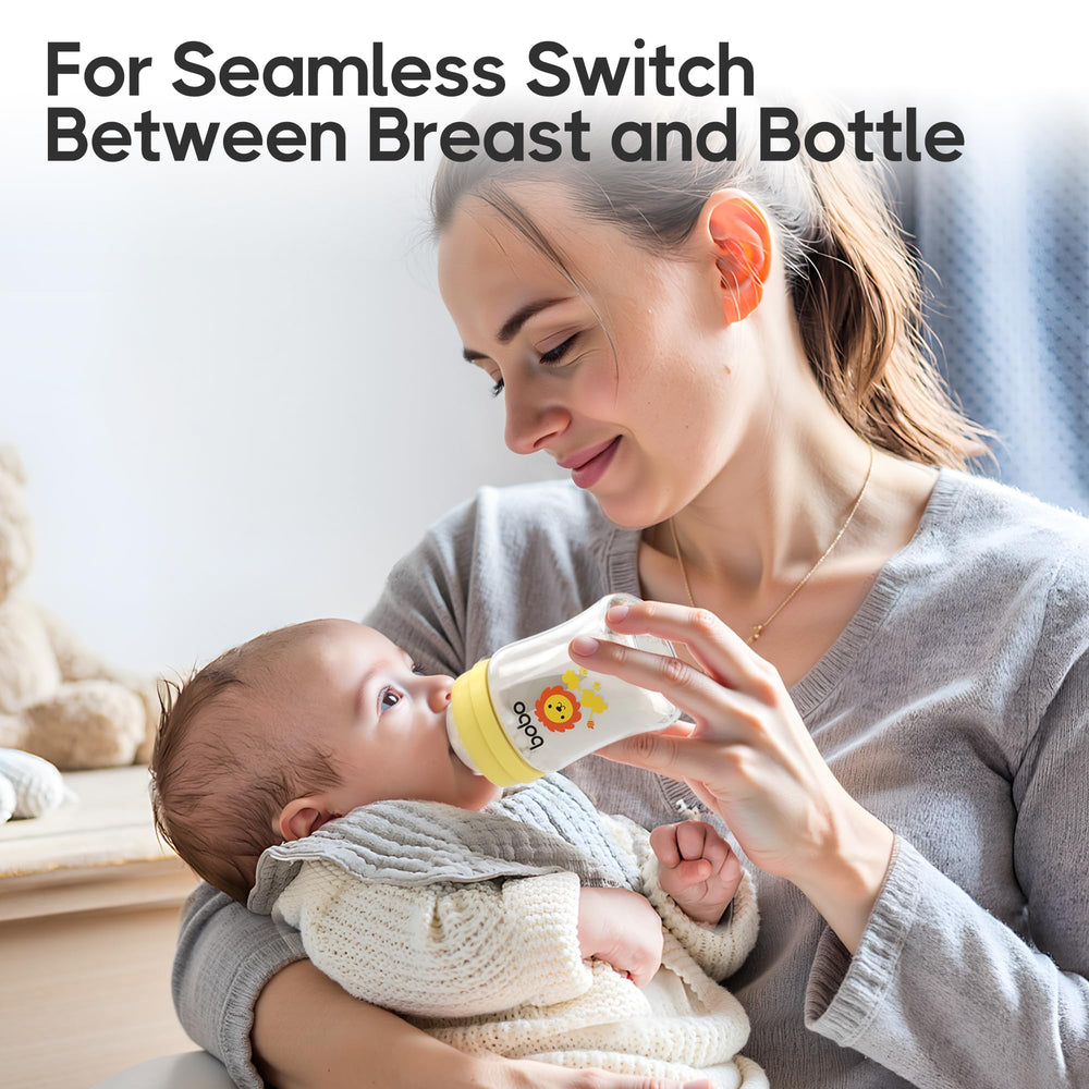 YOHKOH glass baby bottle wide-neck design for easy filling and cleaning.