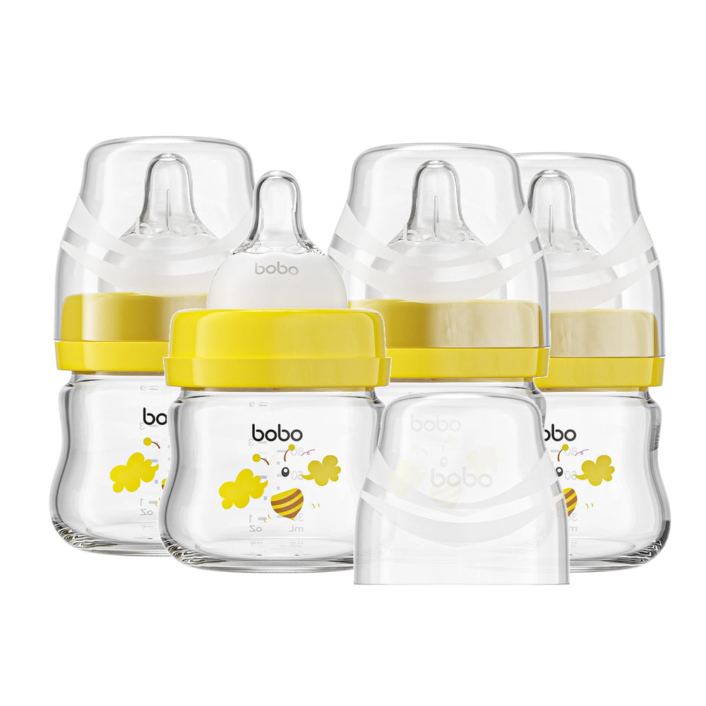 YOHKOH glass baby bottles pack-4 with yellow cap show safe, easy-handling feeding for newborns.