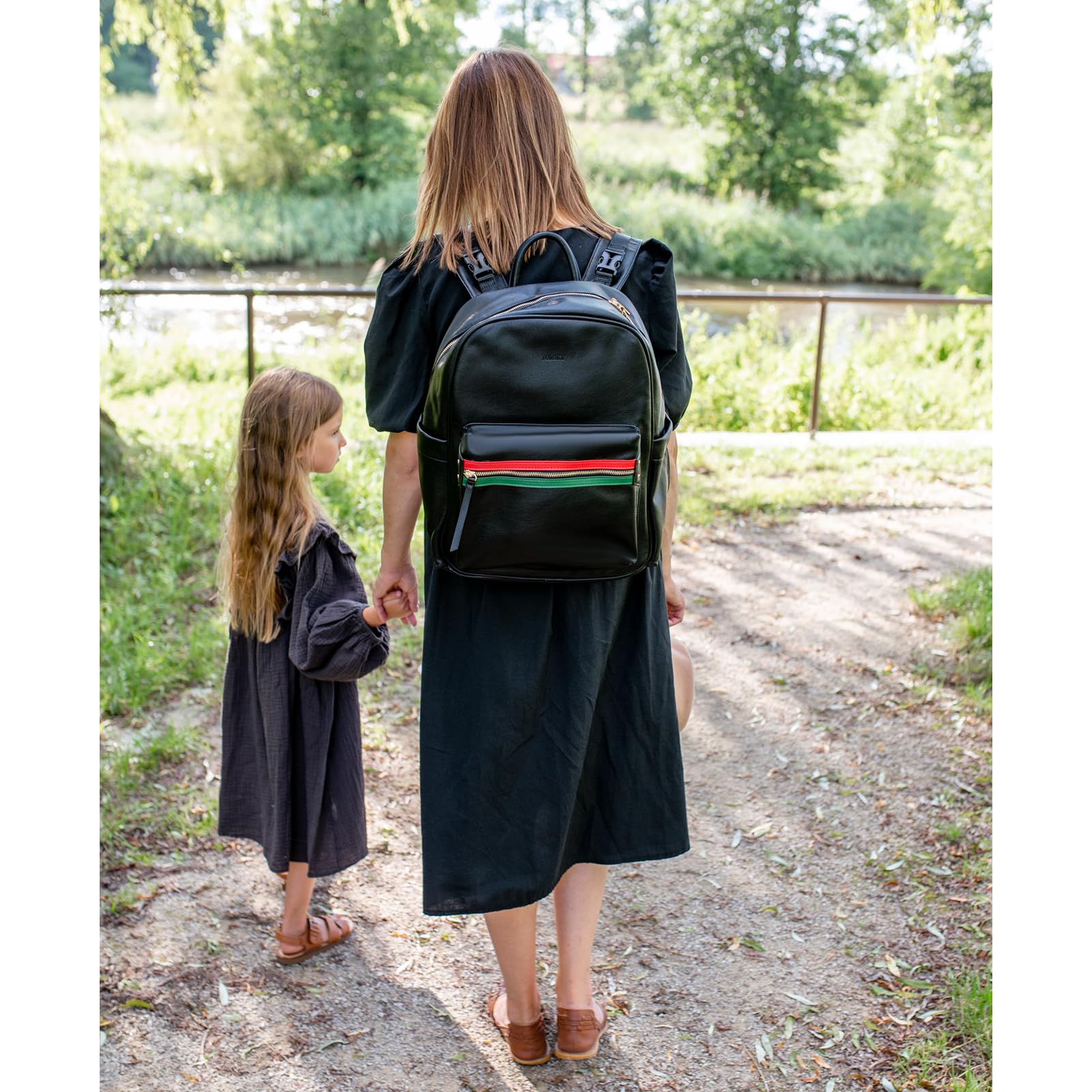 Yomiky leather diaper bag backpack travel-friendly for outings and daily adventures.