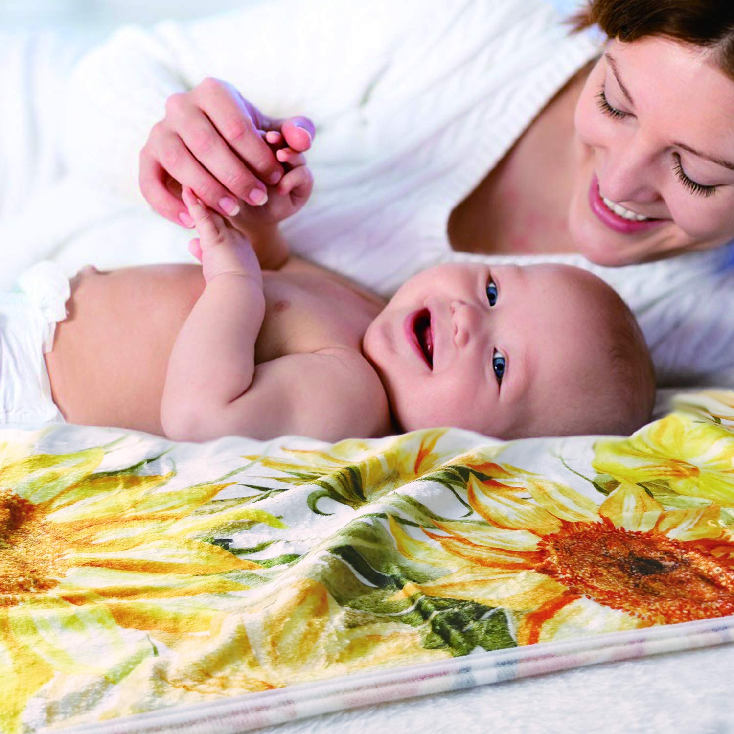 Yoothy Sunflower blanket serves as a photo prop and swaddle for on-the-go moments.
