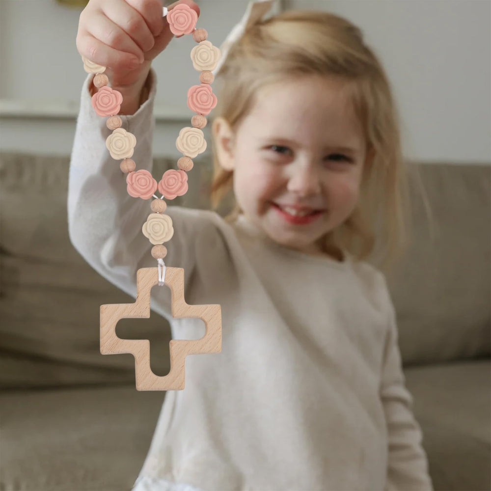 YOUAME first-year birthday rosary in use as decorative toy or keepsake.