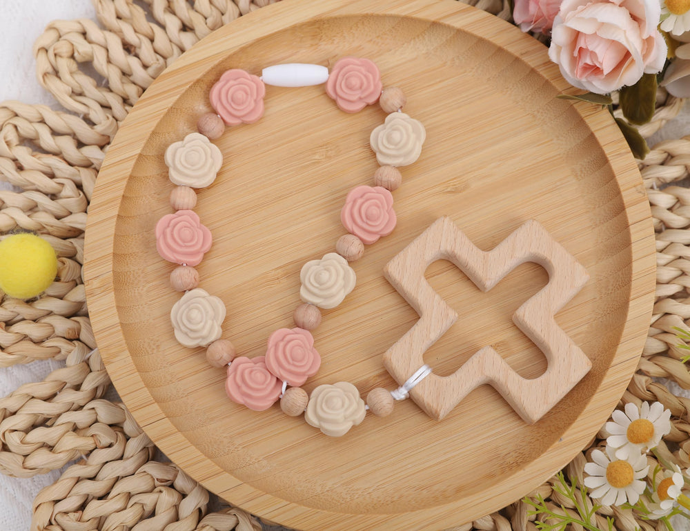 YOUAME pale pink silicone rose beads close-up emphasizes soft tactile feel.