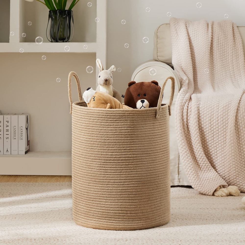YOUDENOVA 72L tall laundry basket in living room demonstrates spacious, clutter-reducing storage.